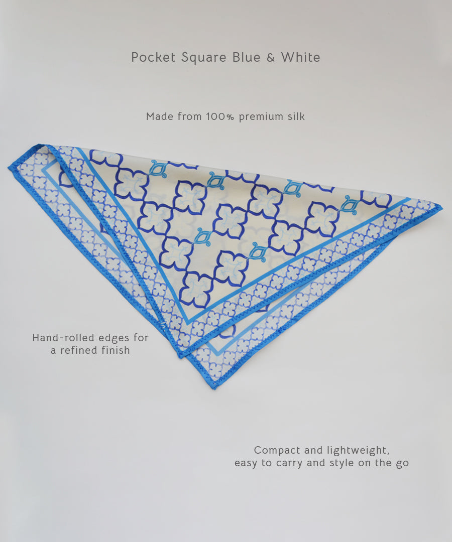 Blue and white pocket square with floral pattern on a light gray background