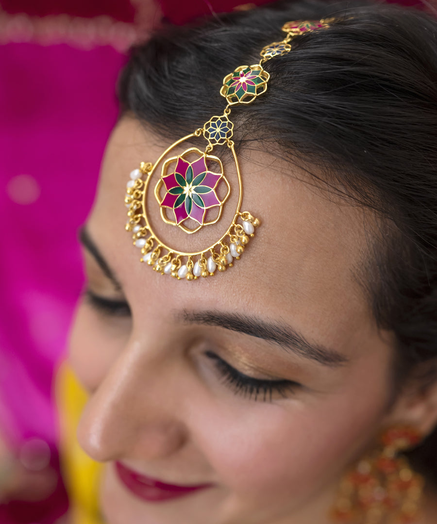 Model wearing pink maang tikka perfect for every occasion. Made form 92.5% sterling silver. Gulaal collection by Manner India.