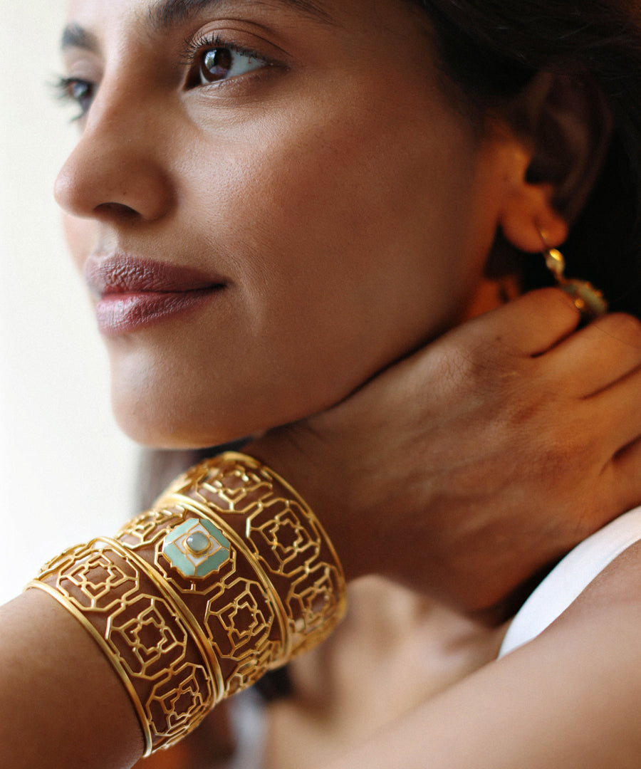 Model wearing three sets of horizon 925 silver gold plated bracelet from tranquil collection.