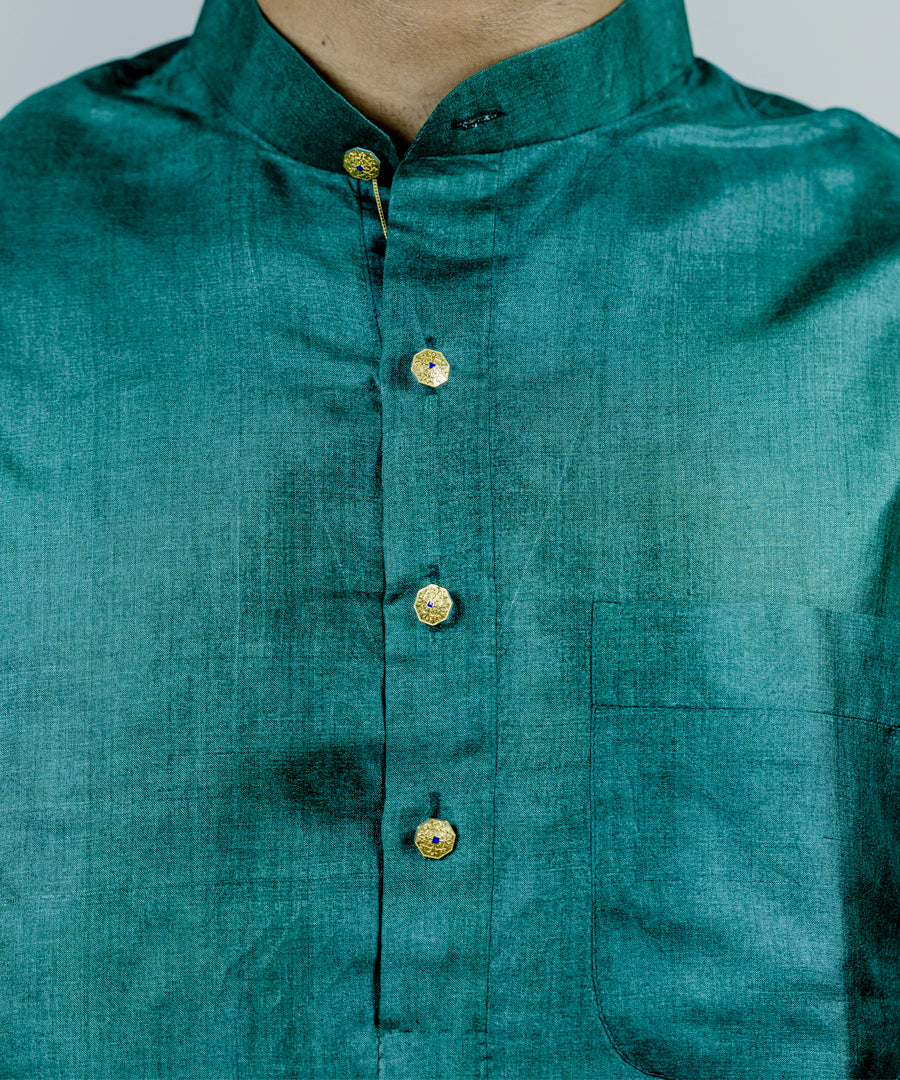 Gold kurta buttons with blue detailing.