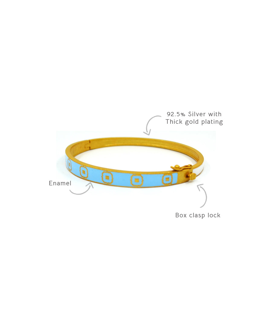 Enamel open ended bracelet with gold plating.