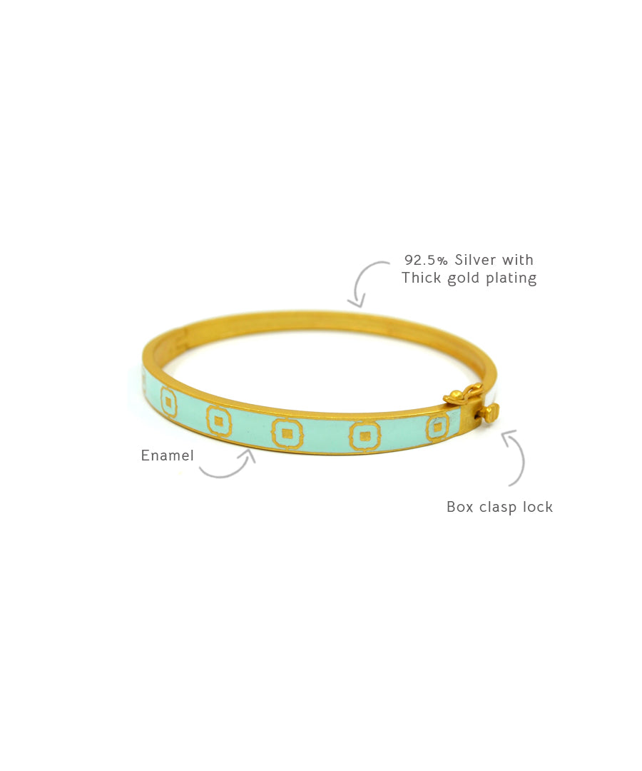 Silver bracelet for women and girls with gold plating and enameling details.
