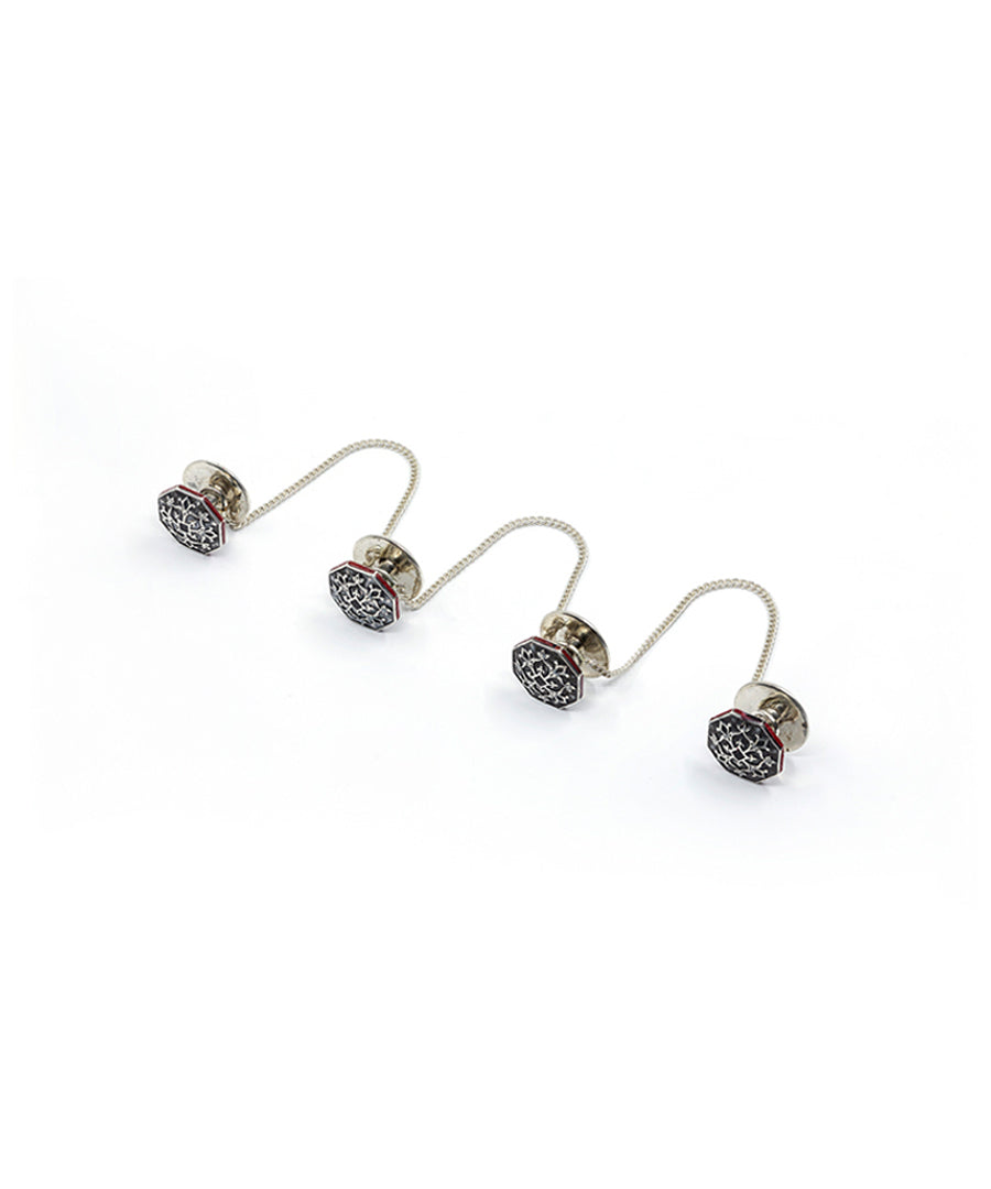 Black kurta buttons with red border.