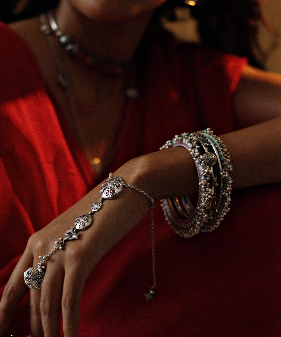 Adjustable layered chain bracelet in sterling silver.