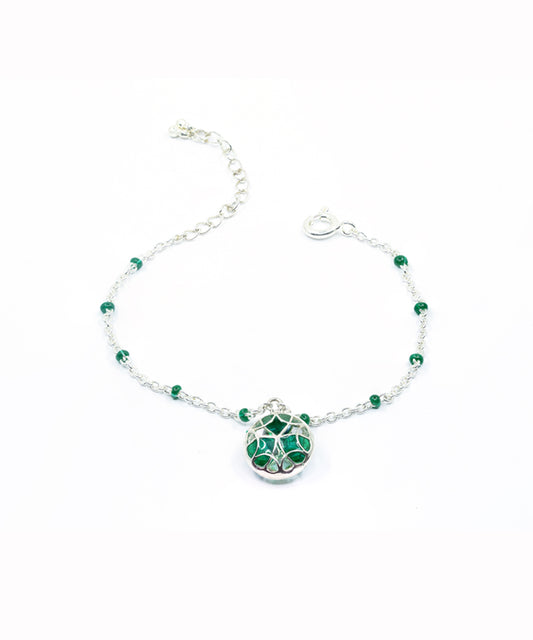 Green adjustable tarnishfree water resistant charm bracelet.