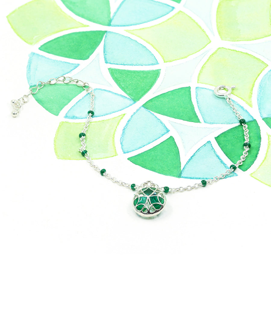 Kaleidoscope green enamel tarnishfree chain charm bracelet by manner india.