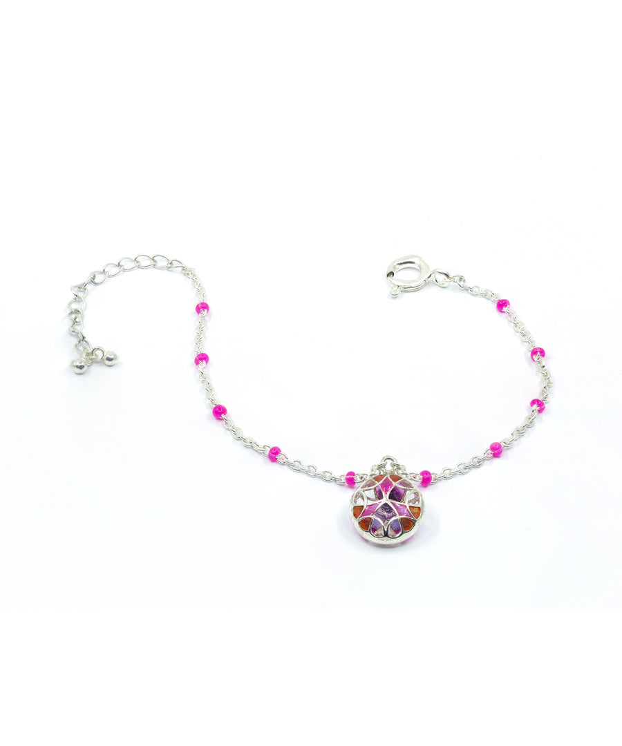 925 silver charm bracelet with tarnishfree coating and enameling details.