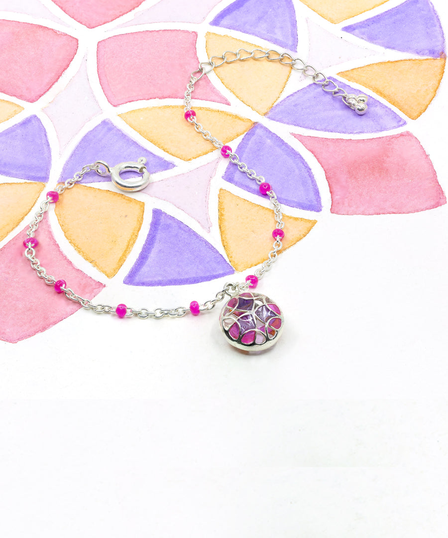 Pink enamel charm bracelet from kaleidoscope collection.
