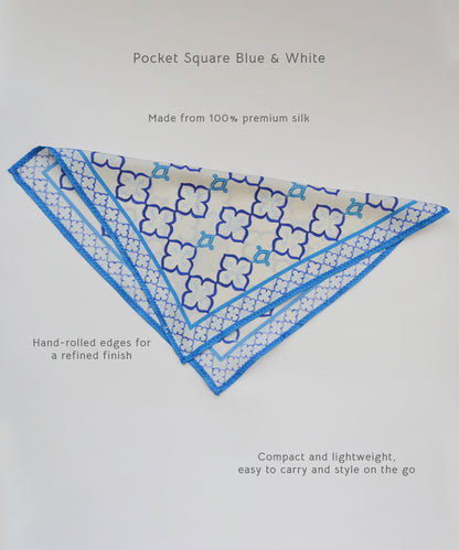 Blue and white pocket square with floral pattern on a light gray background
