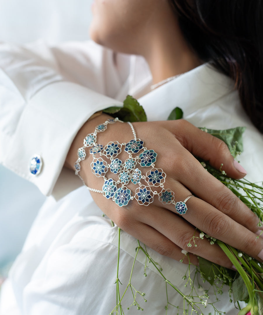 Hand wearing floral jewelry 925 silver with enamel work